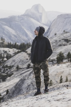 a man standing on a snowy mountain