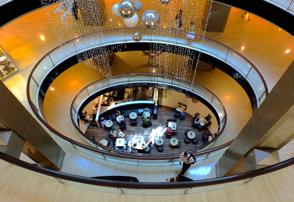 a circular ceiling with a group of people inside