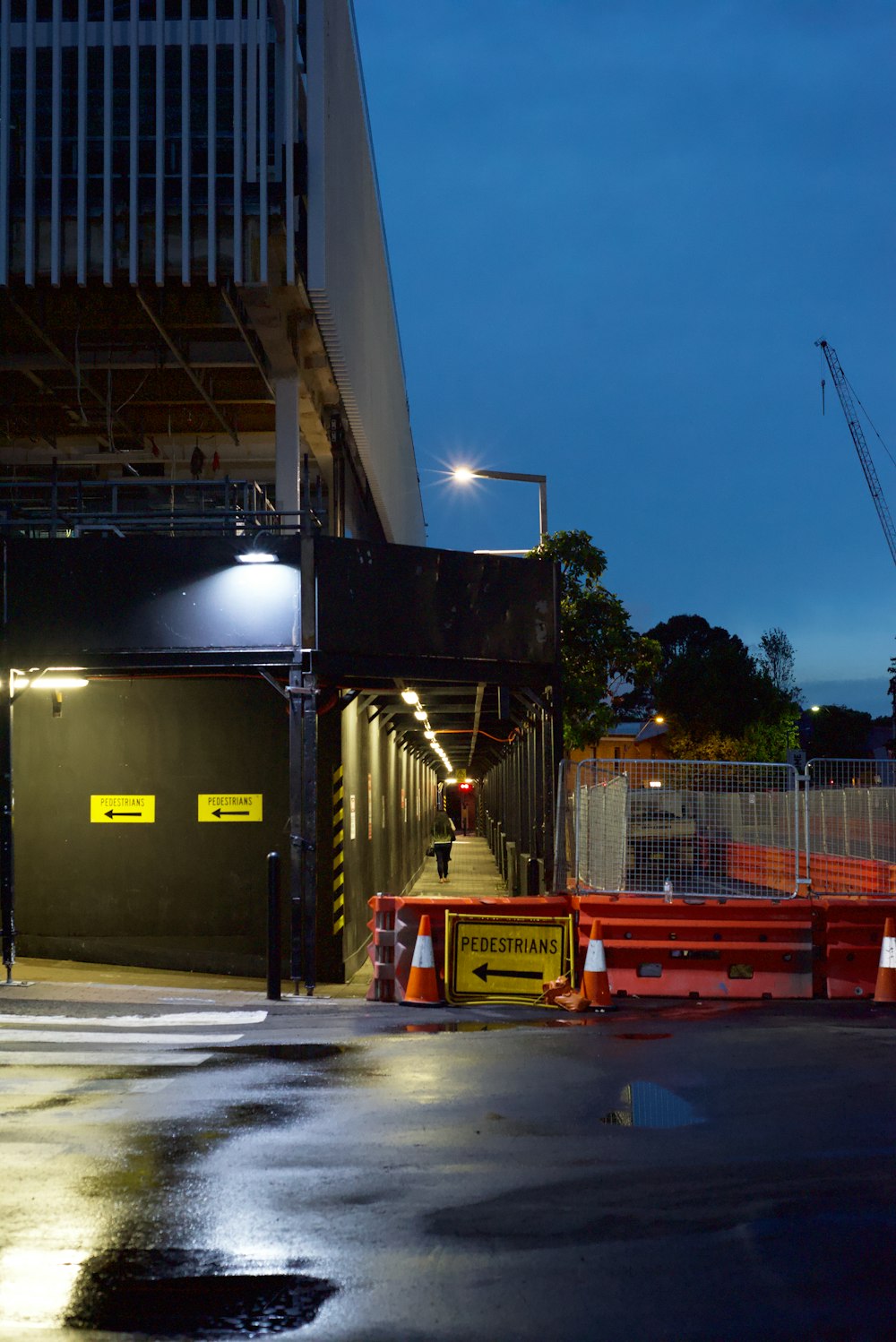 a construction site with a building in the background