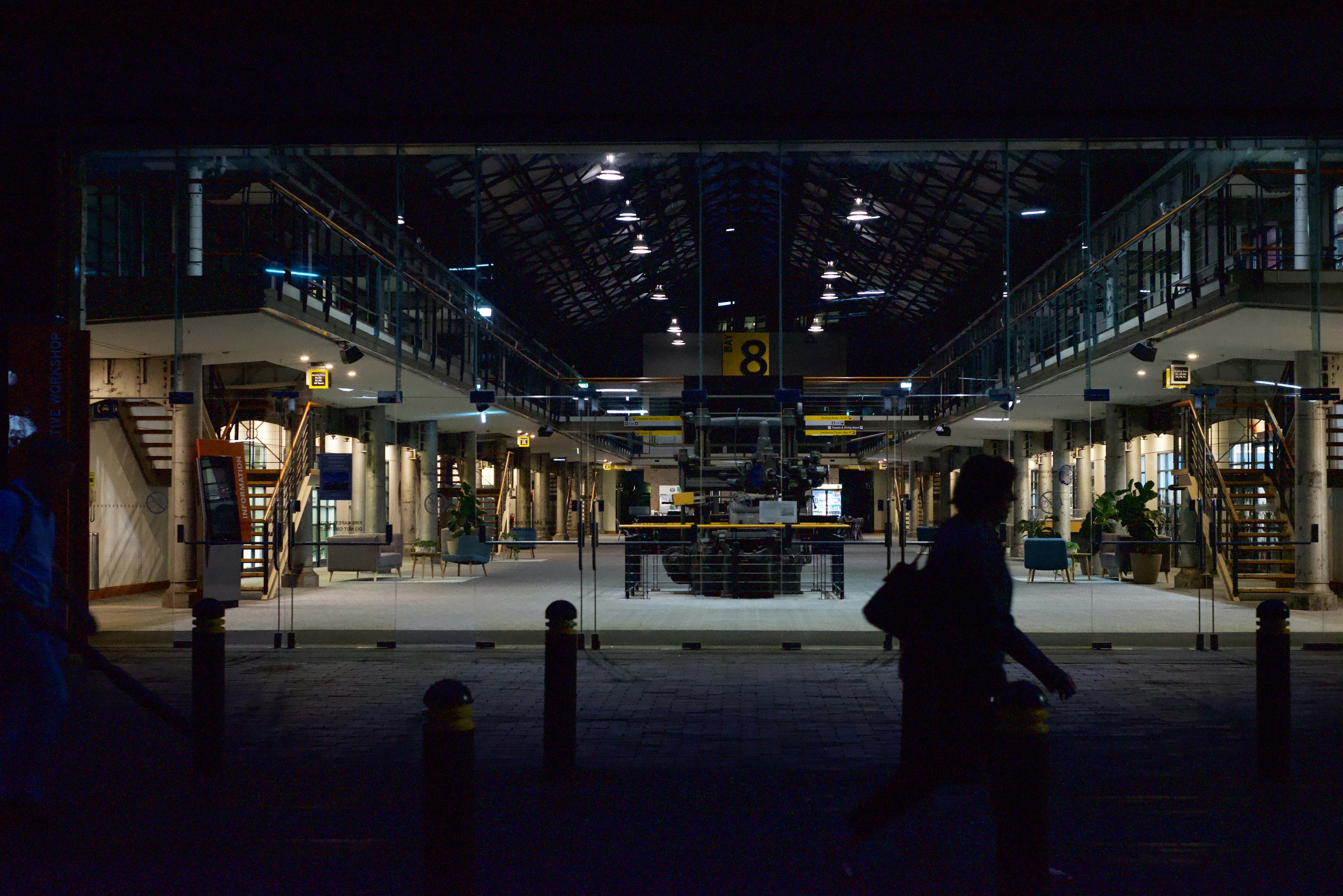 Person walking through a large station hall