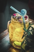 a glass jar with a straw