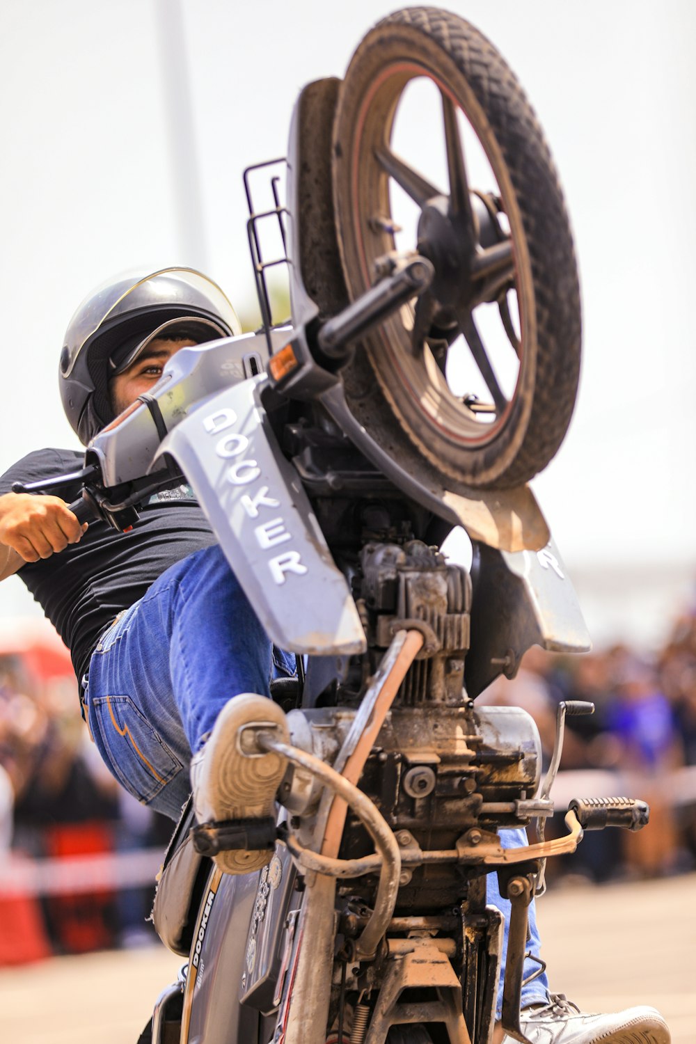 a person doing a wheelie on a motorcycle