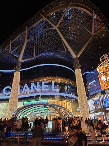 Suhatta Mall's modern facade lit up at night.