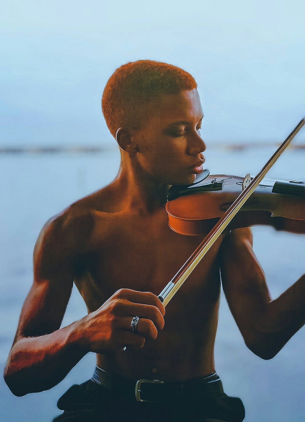 a man playing a violin