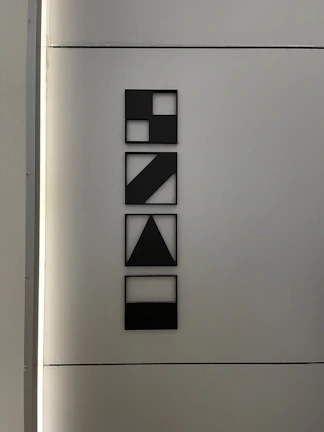 Close-up of a contemporary art piece featuring clean lines and muted tones.