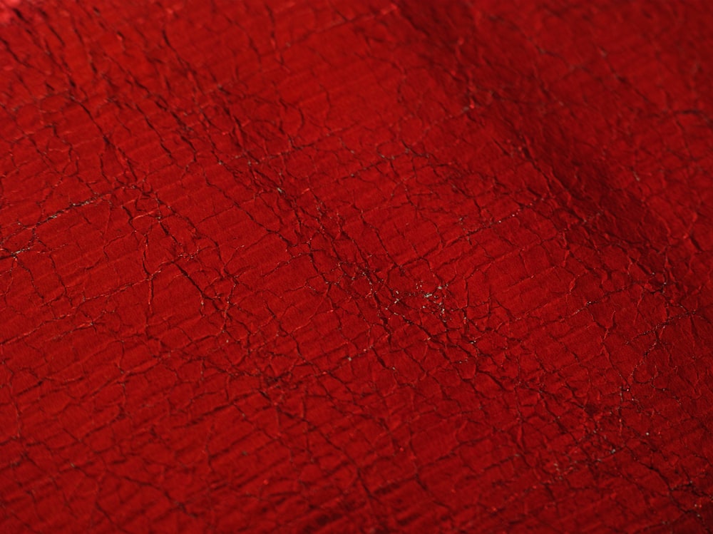 a red surface with cracks