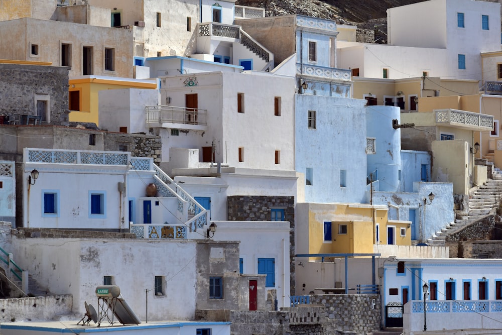 a group of buildings with balconies and a staircase