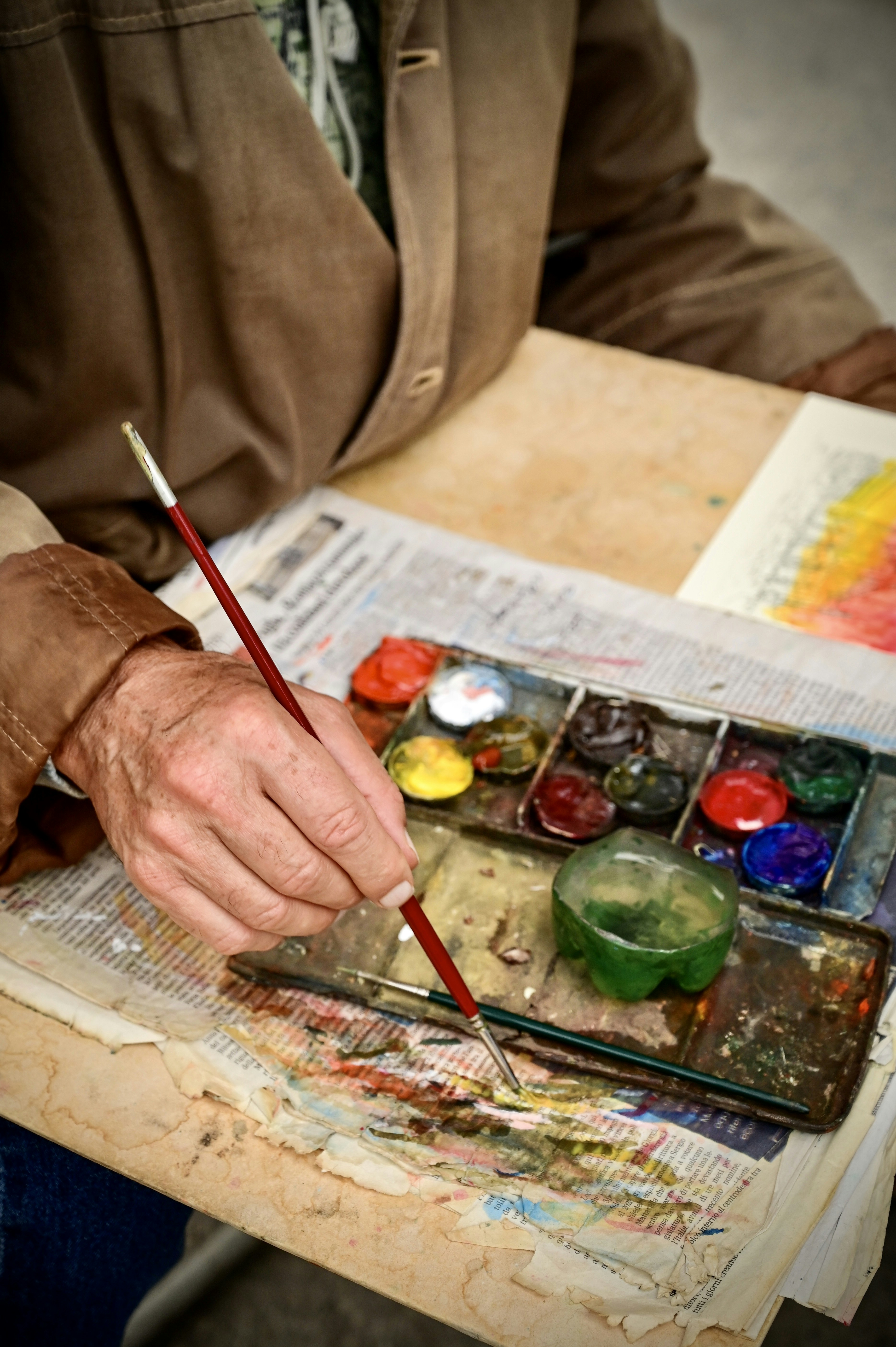 a person painting with a brush