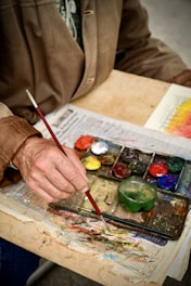 a person painting with a brush