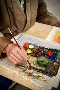 a person painting with a brush
