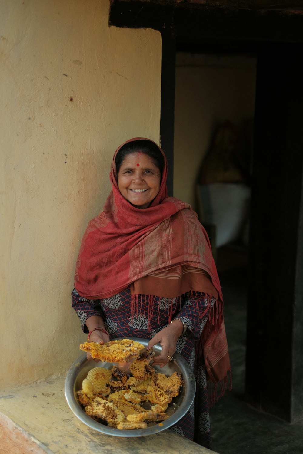 a woman holding a bowl of food