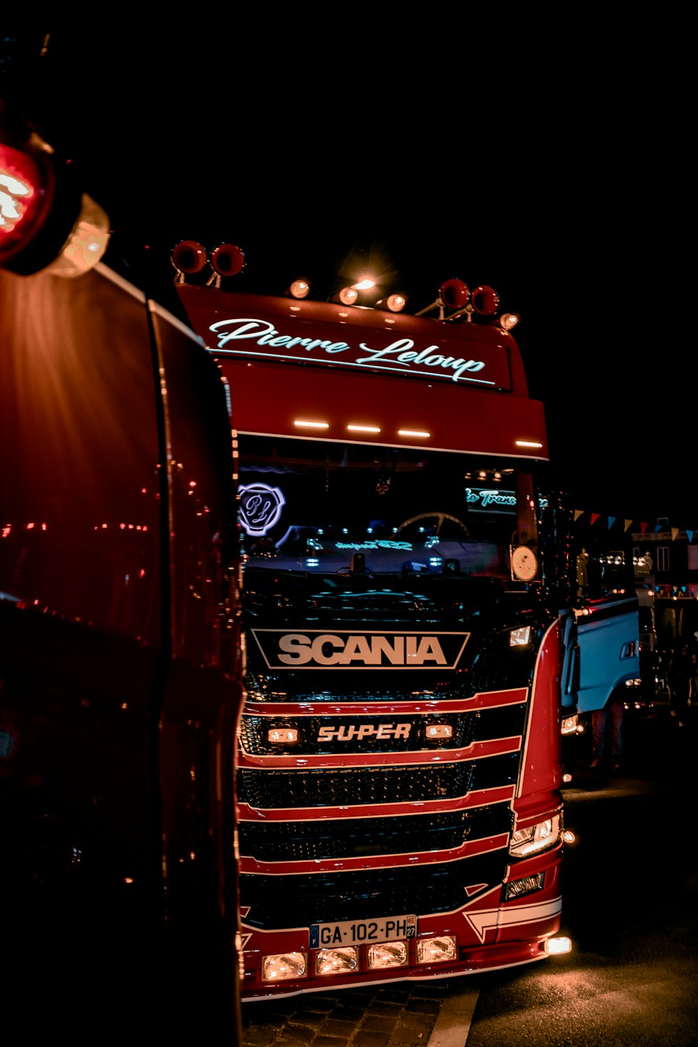 a large red truck with lights