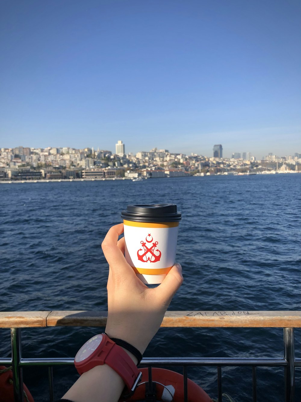 a person holding a coffee cup