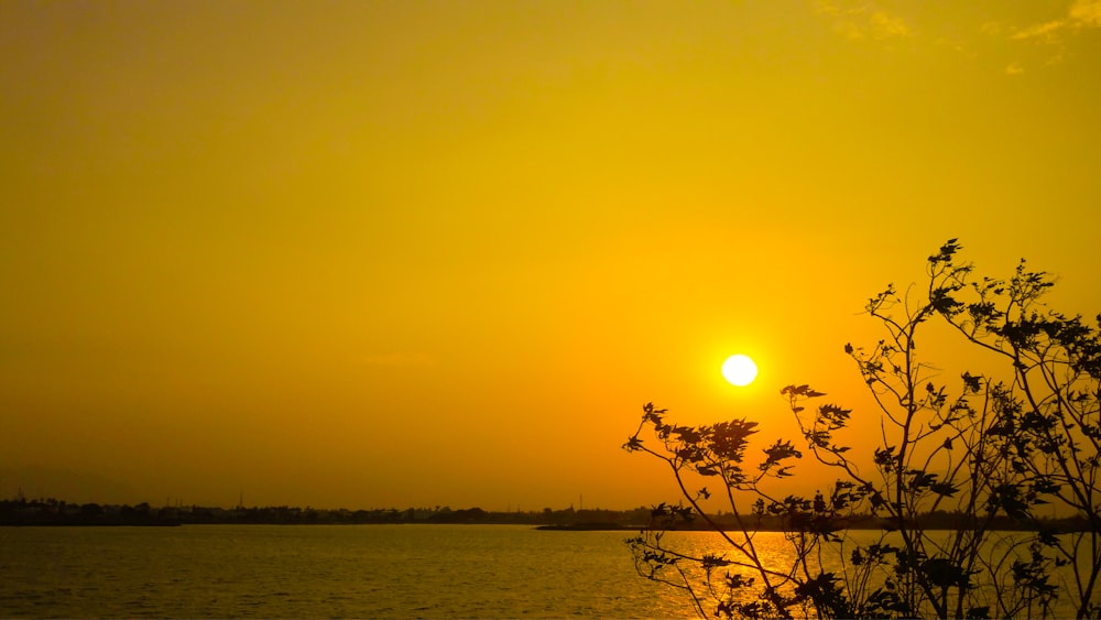 a sunset over a body of water