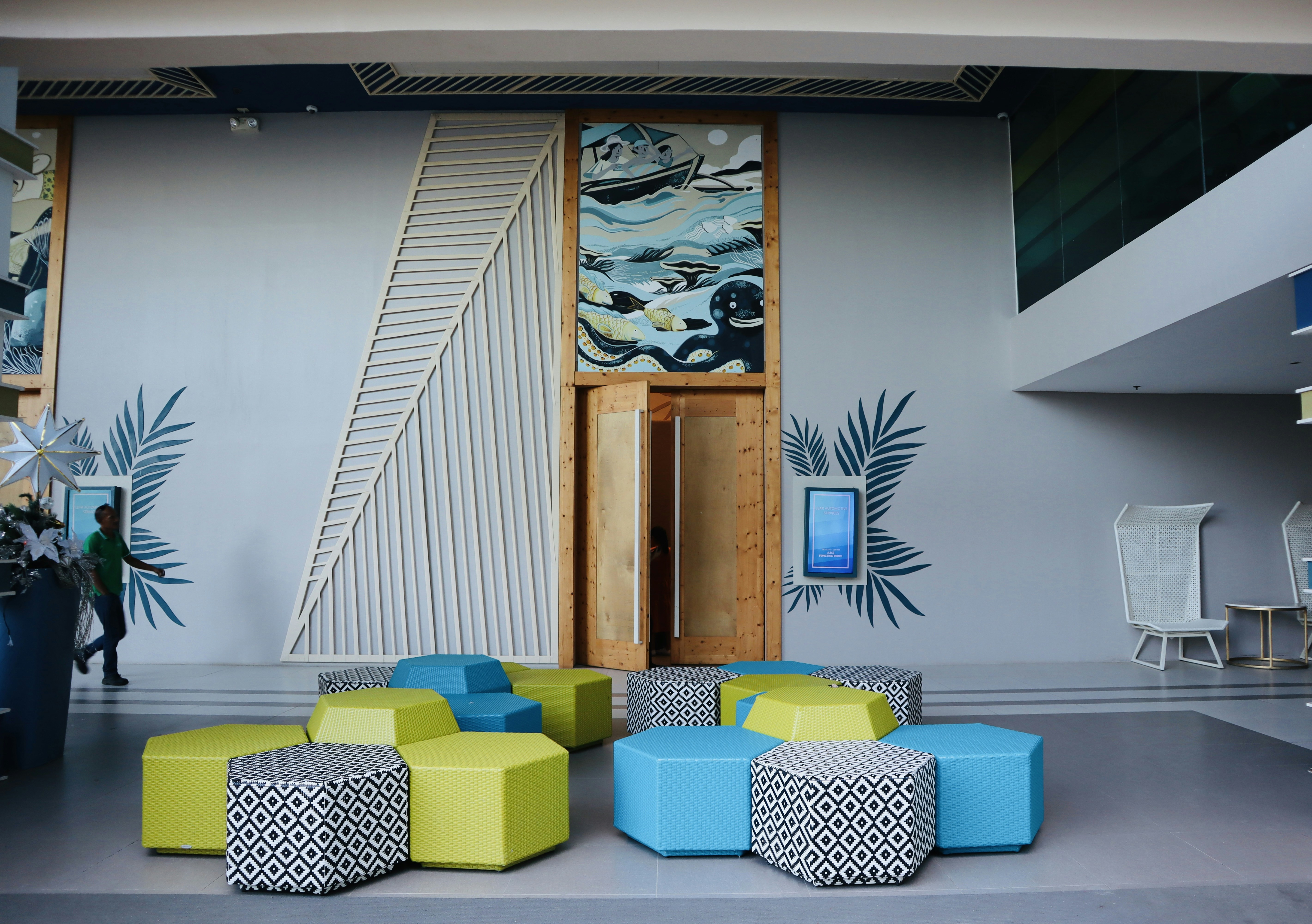 a room with a couch and chairs