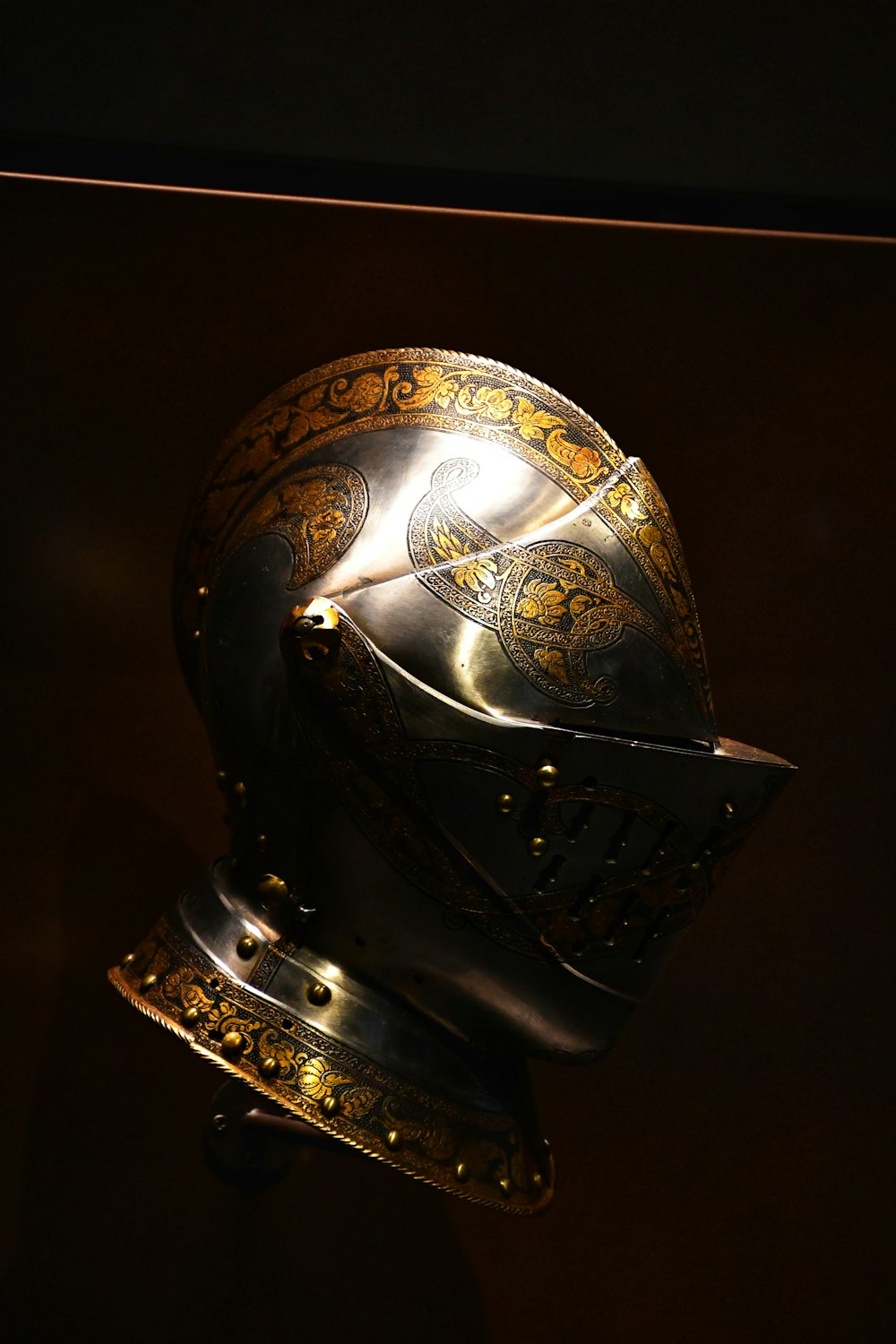 a gold helmet with a gold face