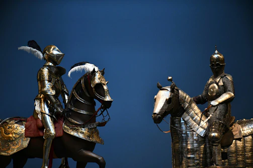 Knights in armor clashing during a fierce battle.