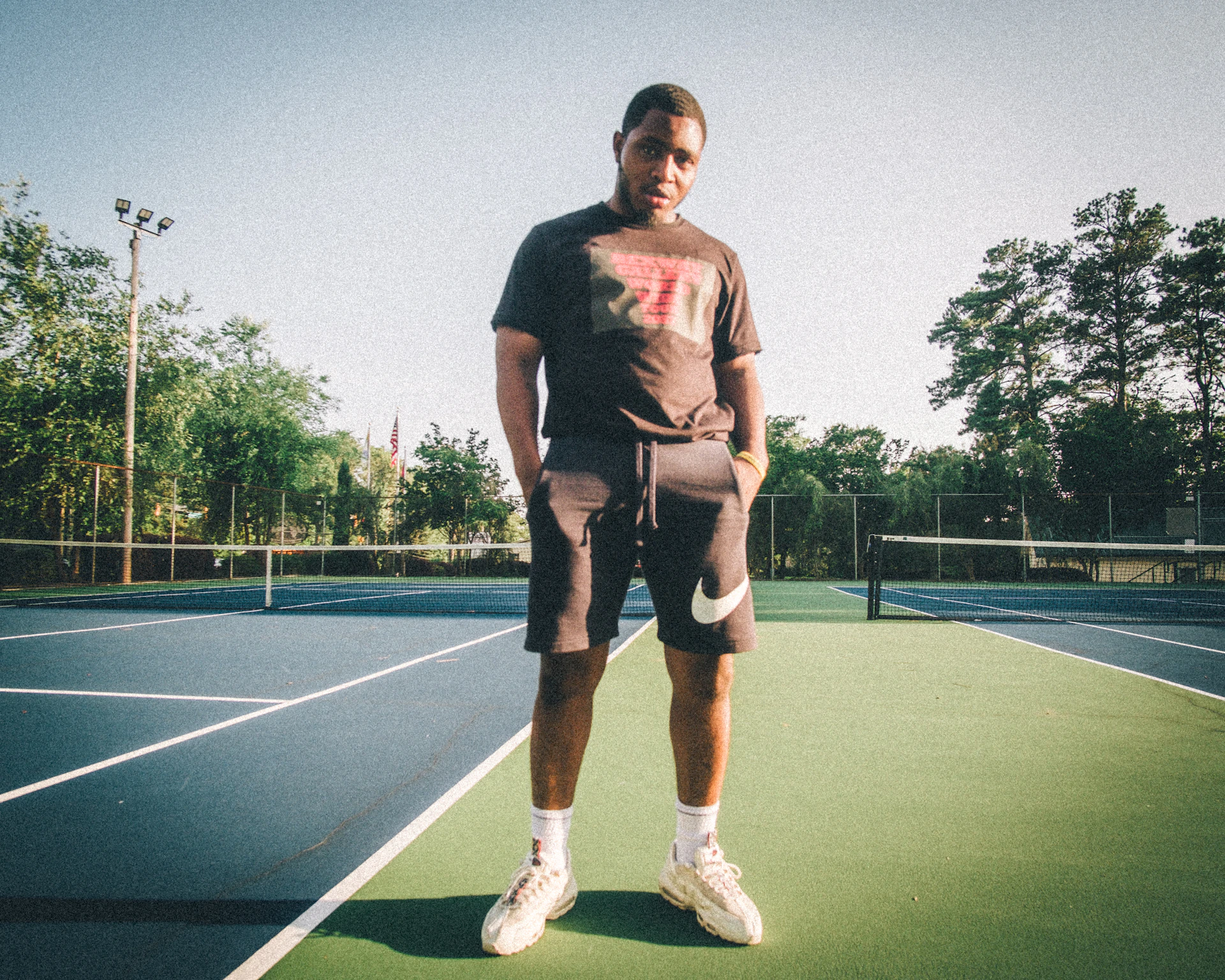 a man standing on a tennis court
