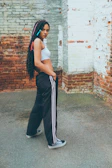 a person leaning against a wall