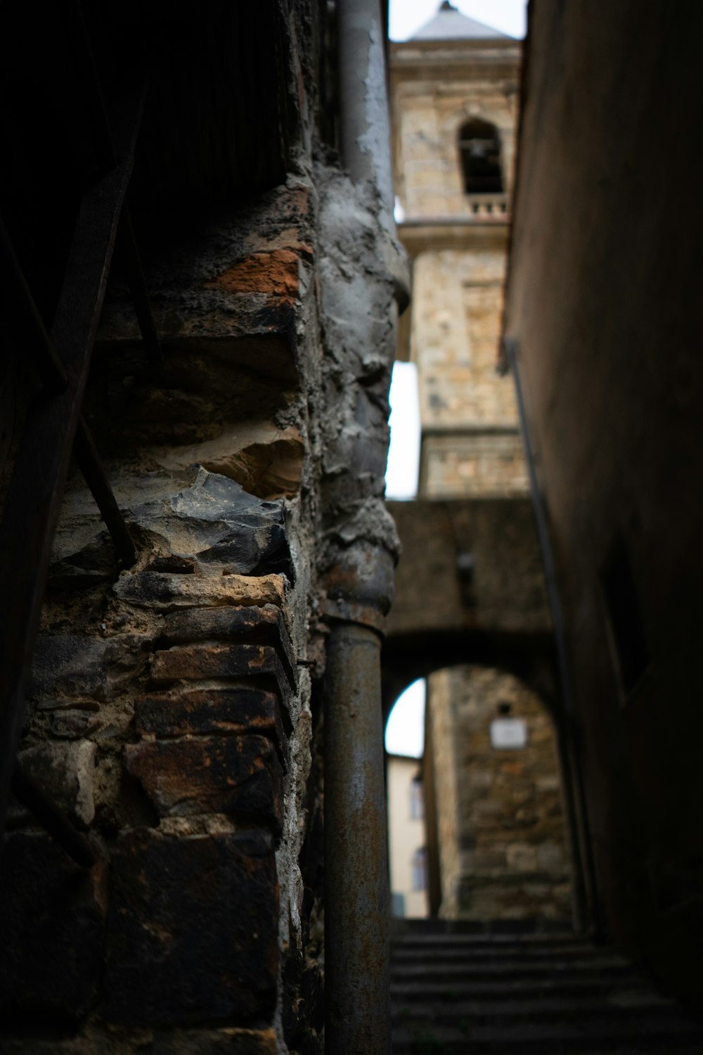 a stone staircase with a brick building