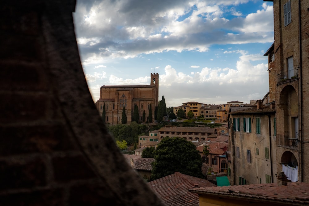 a view of a city from a stone ledge