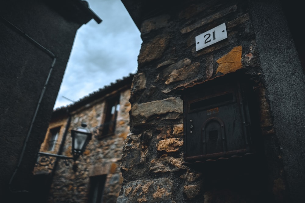 a brick building with a sign on it