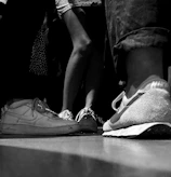 A joyful group photo of the shoeless ones team and local families after a donation event.