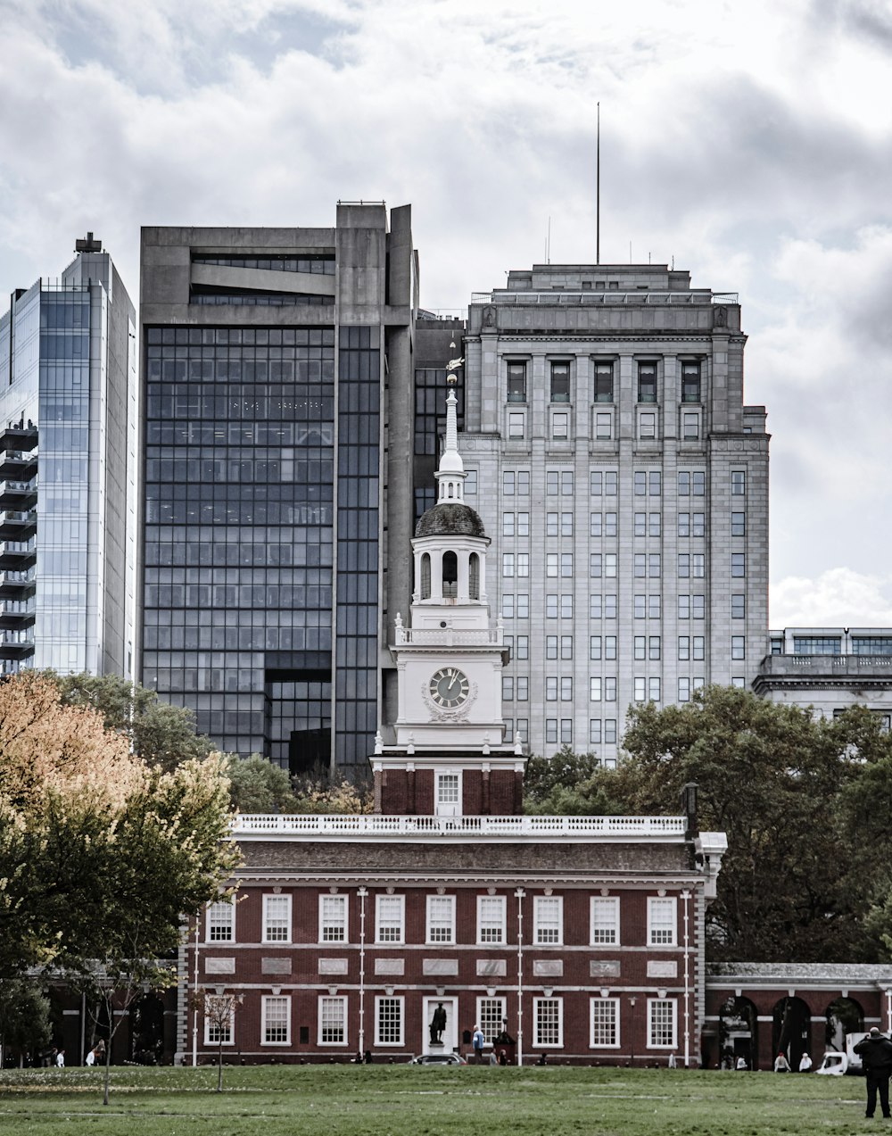 a clock tower in front of a large building