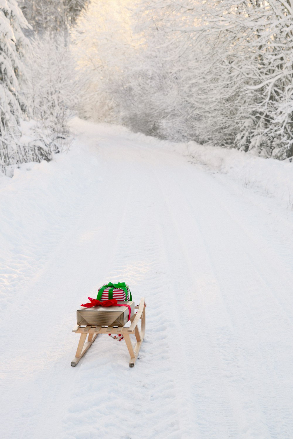 a sled with a blanket on it in the snow