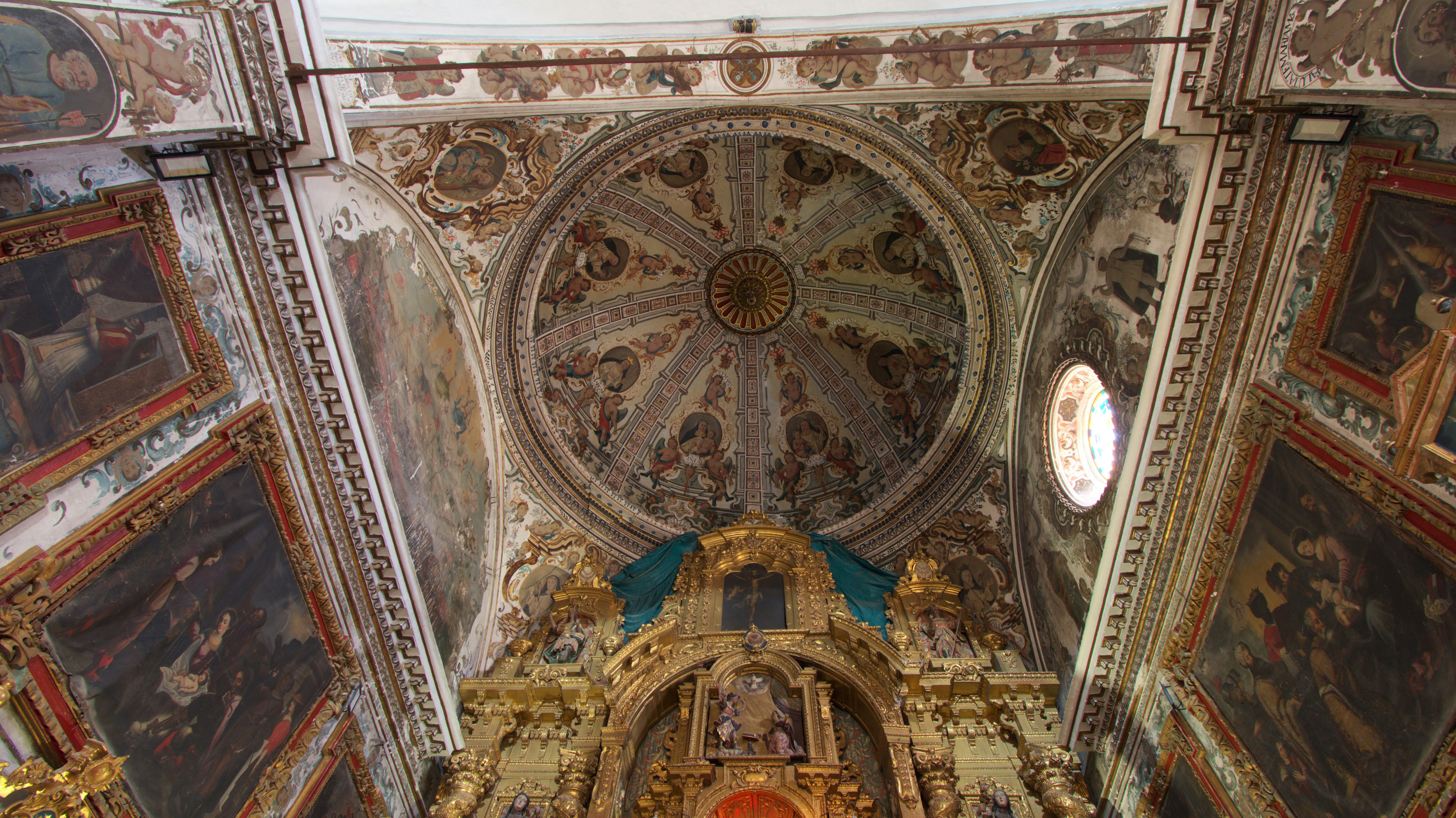 a large ornate ceiling with paintings