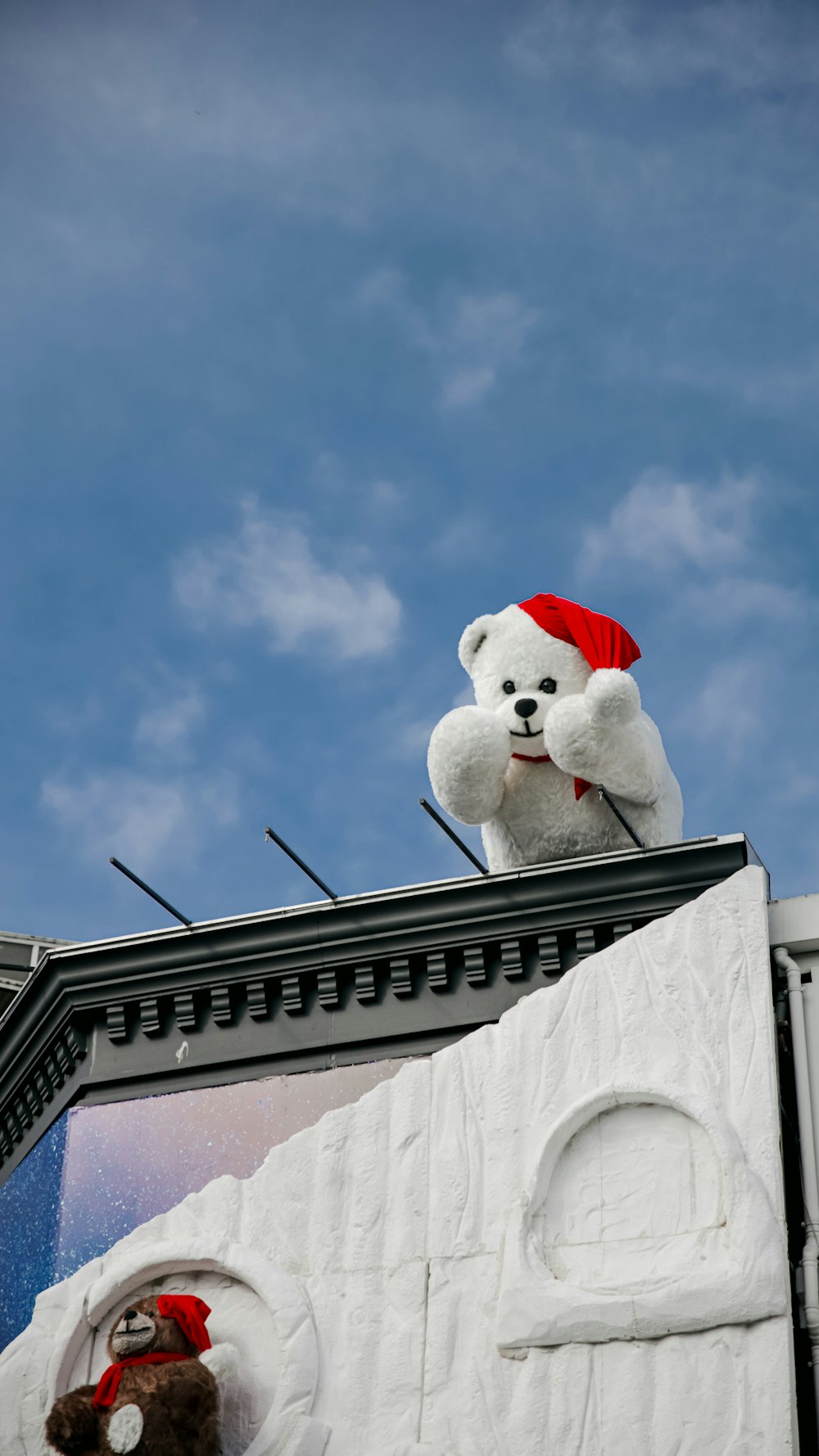 a stuffed animal on top of a building