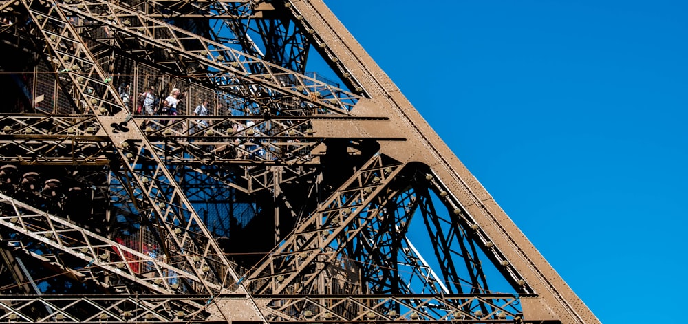 a group of people on a tall metal tower