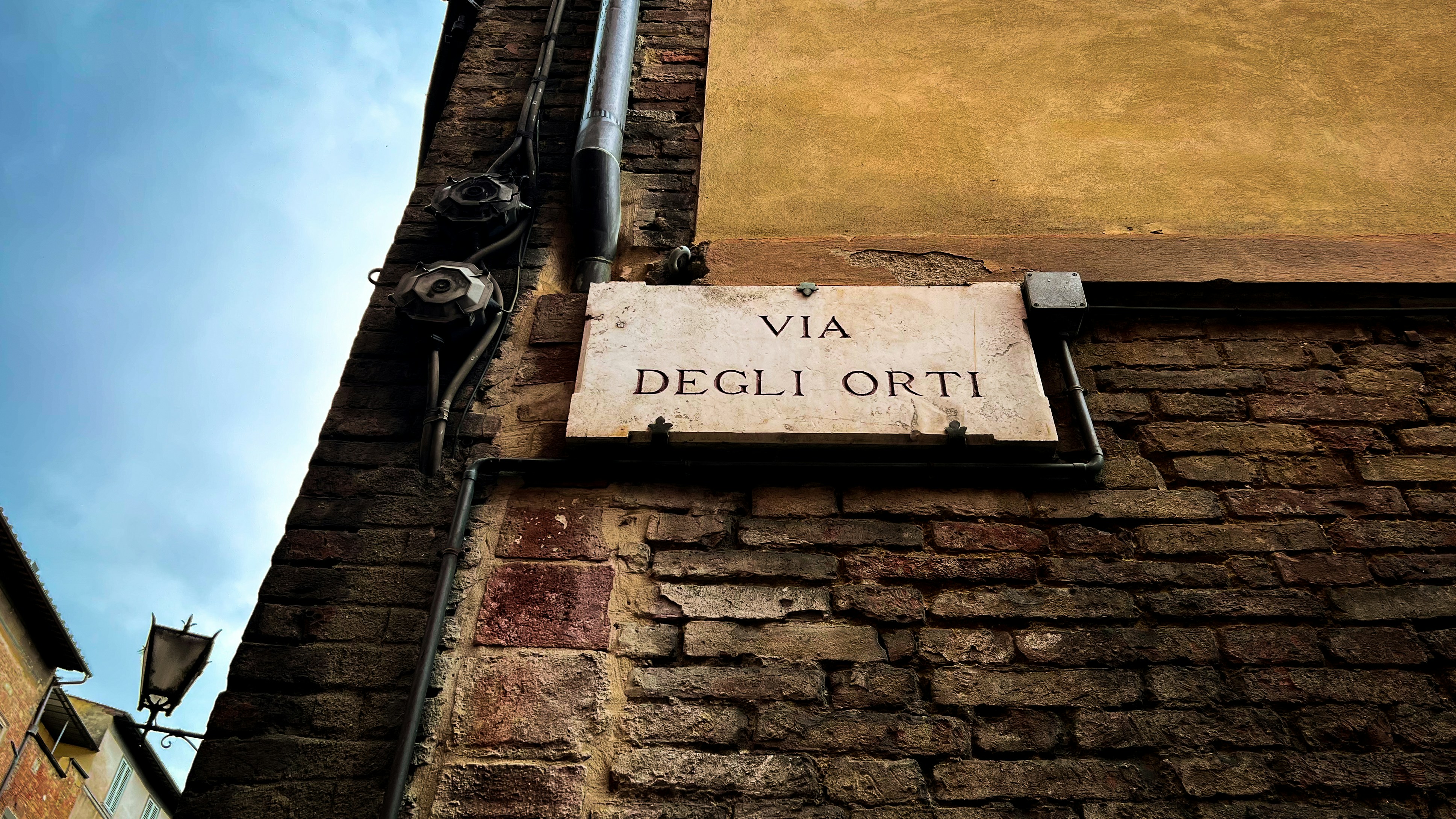 a sign on a brick wall