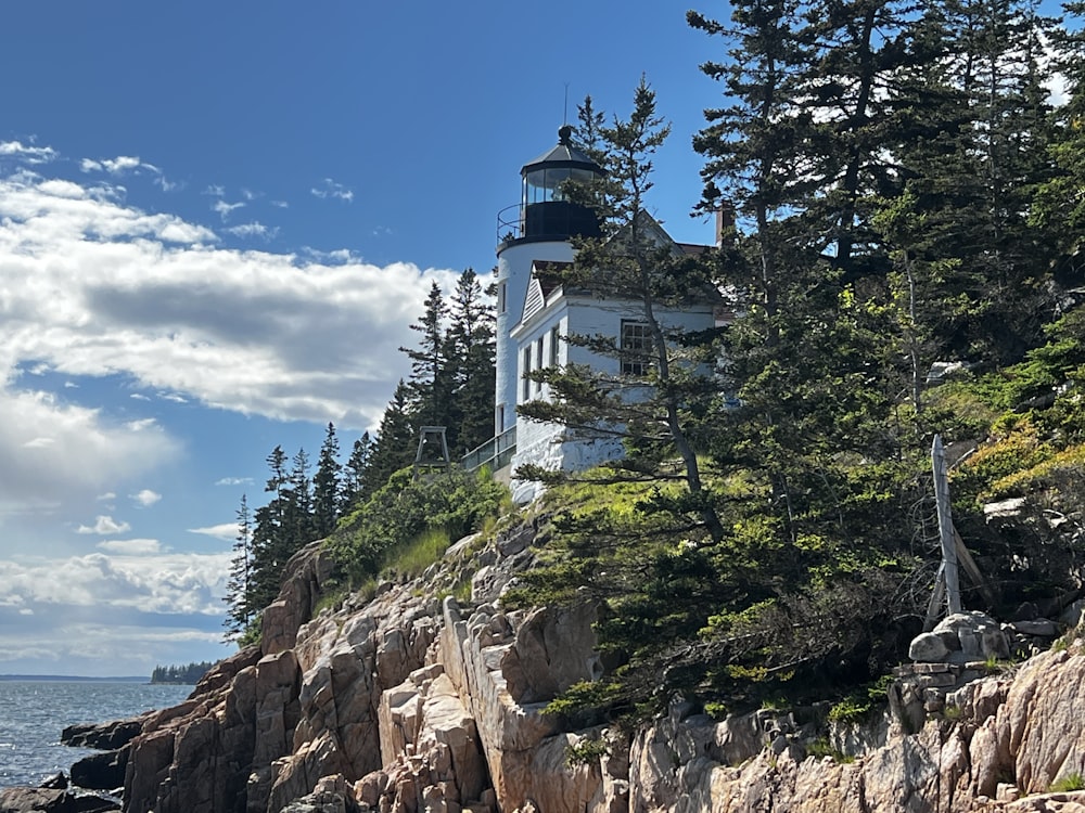 a white building on a rocky hill