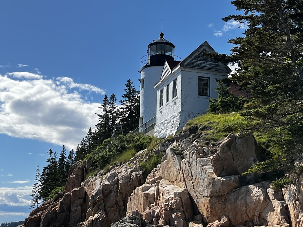 a white building on a rocky hill