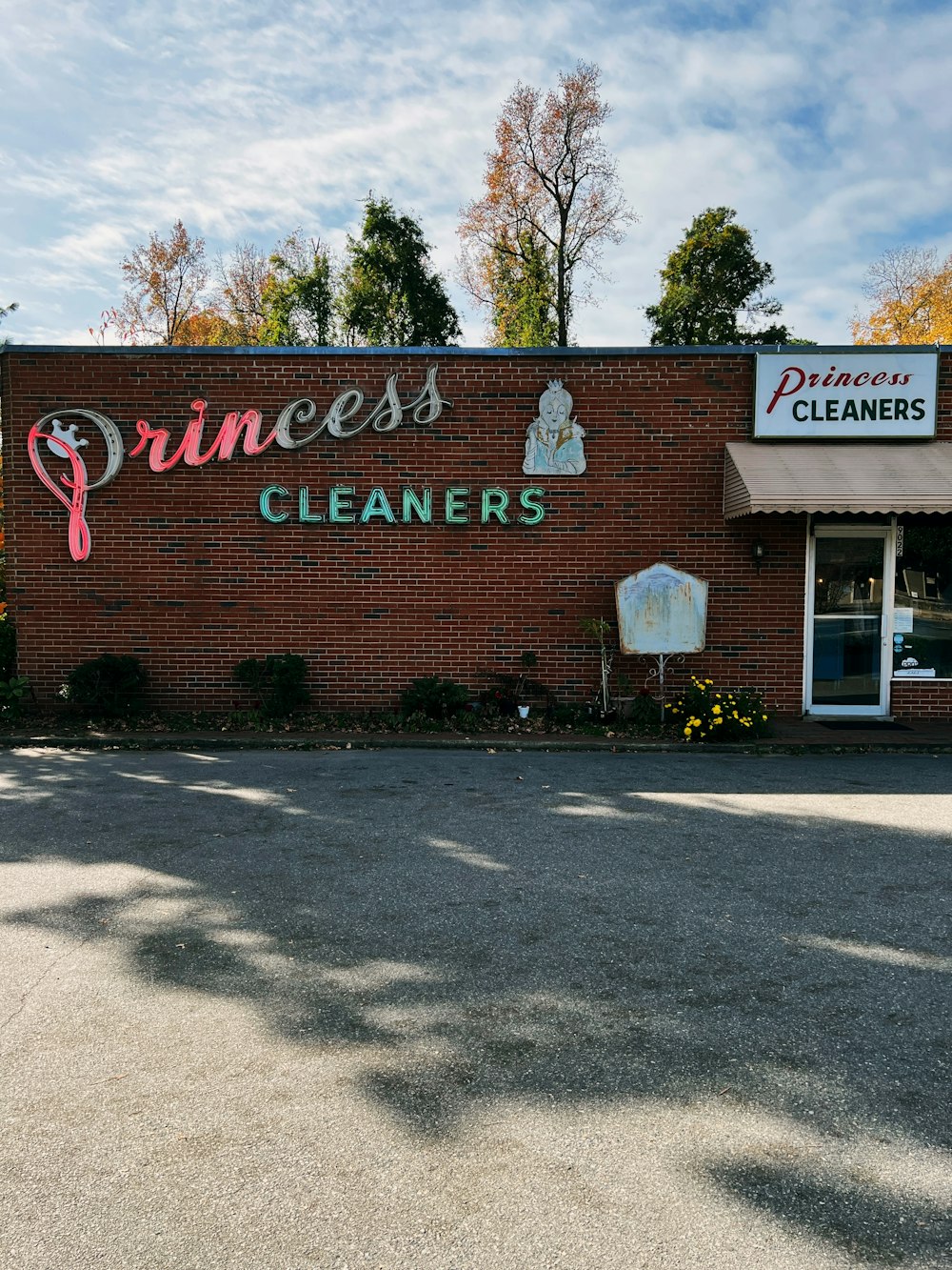 a brick building with a sign on it