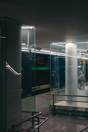 a glass walled building with a glass door and a glass wall