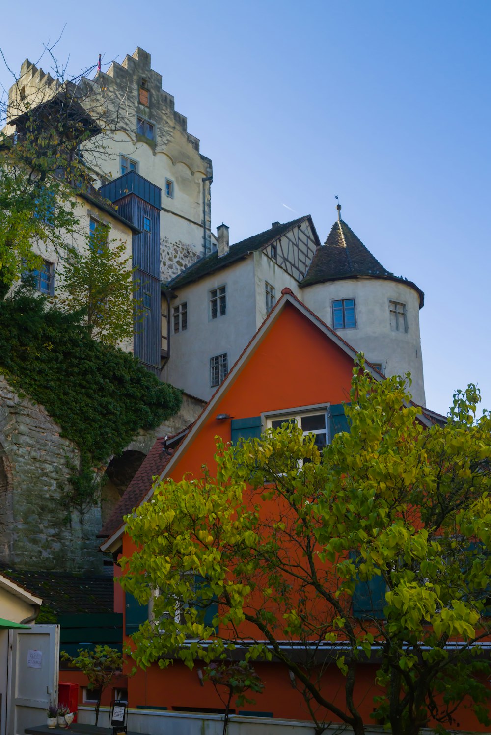 a group of buildings with trees in front of them