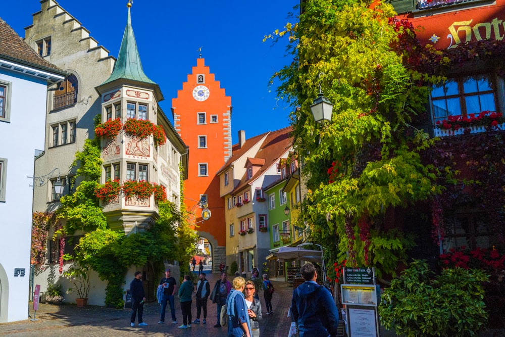 a group of people walking in a town