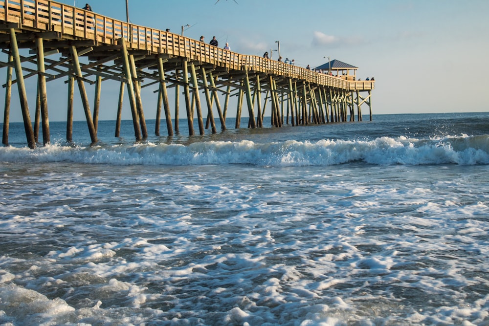 a long pier with people on it