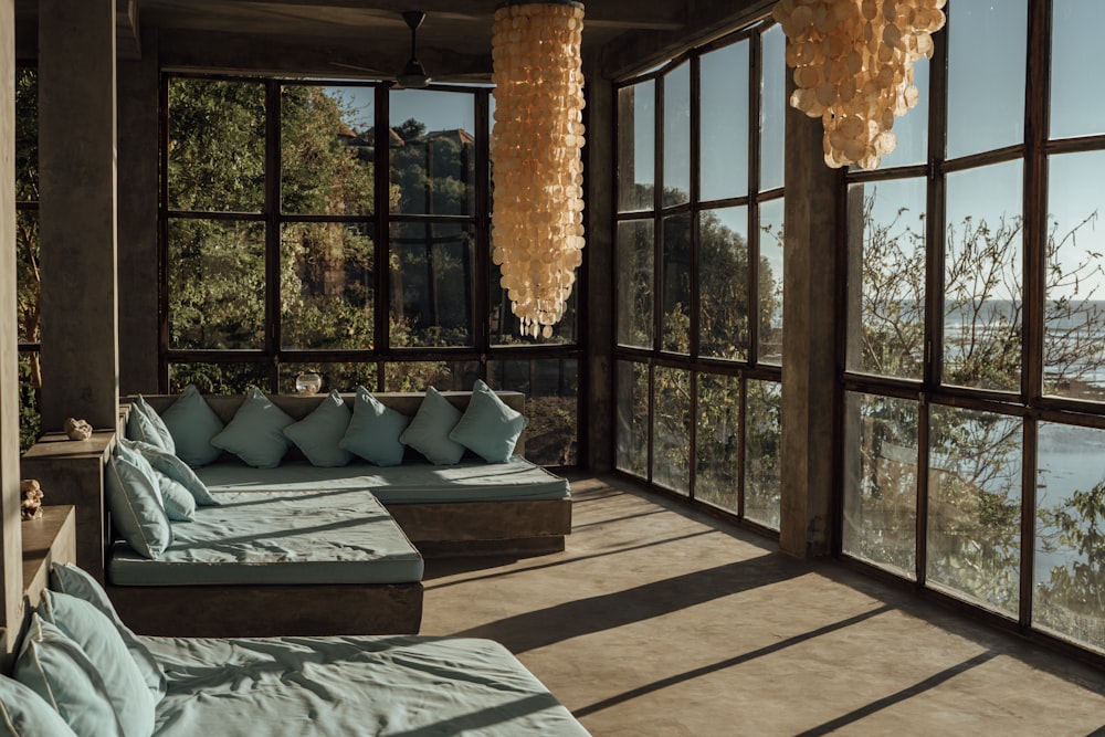 a room with windows and a couch