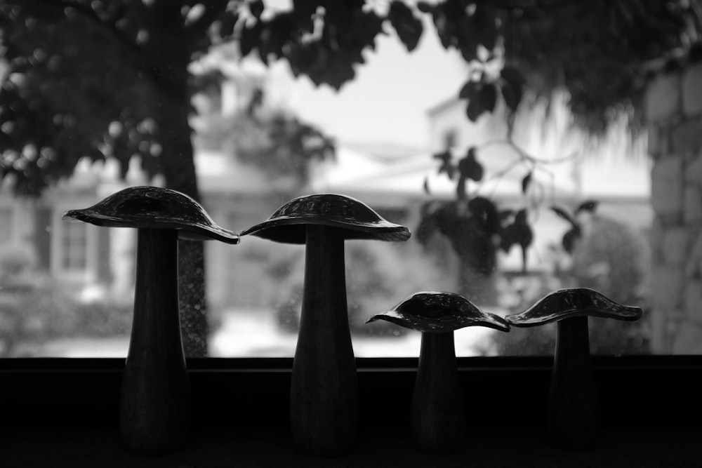 a group of metal objects in front of a window