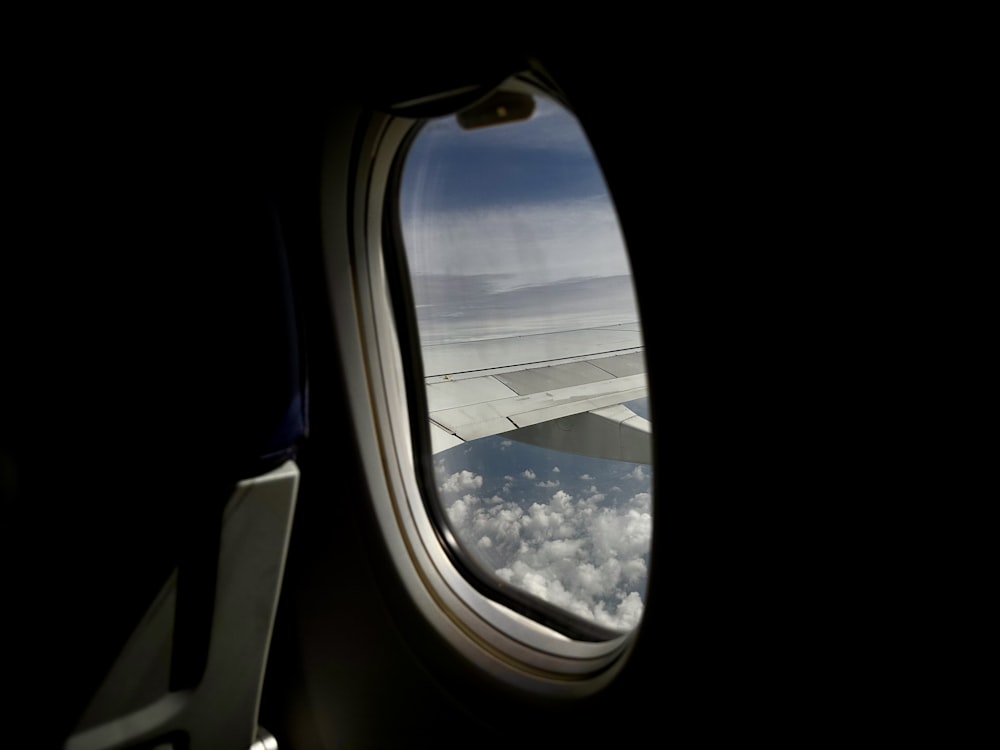 an airplane window looking out at the earth
