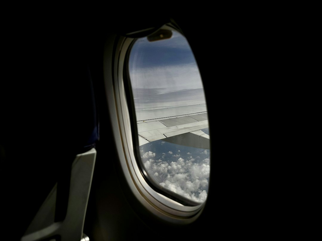 an airplane window looking out at the earth,
