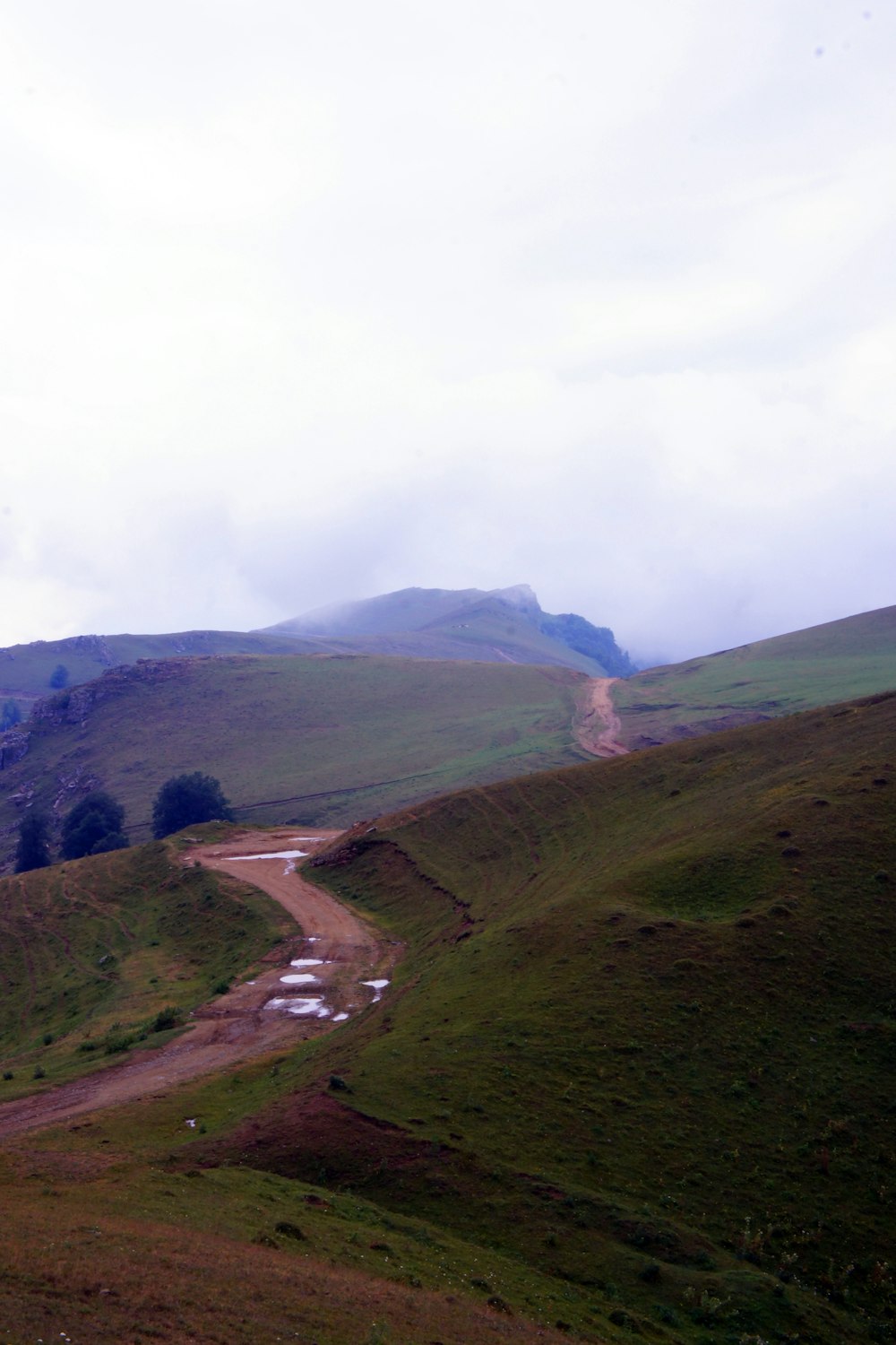 a winding road through a valley