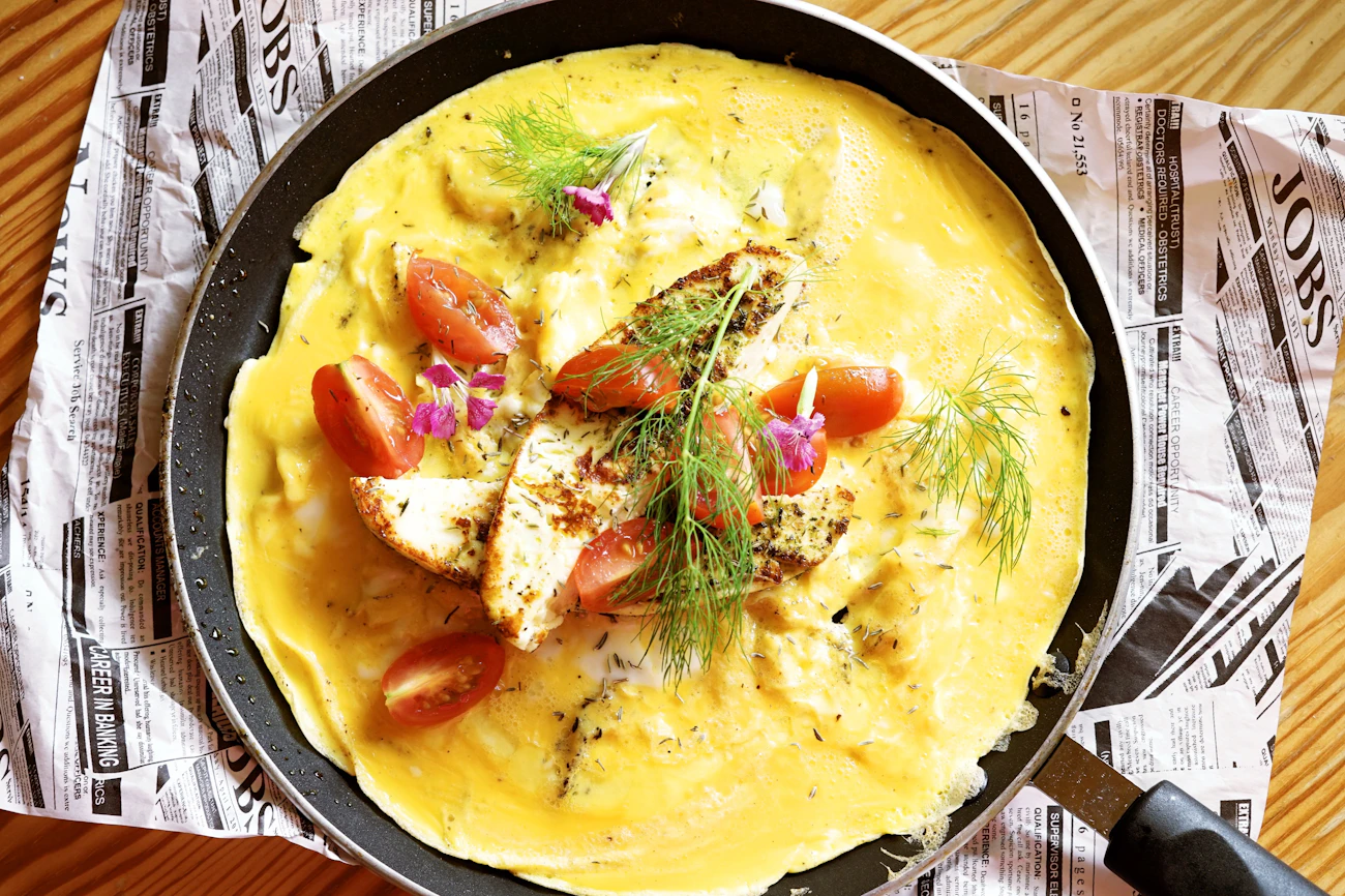 Golden omelette-style dish served on a plate