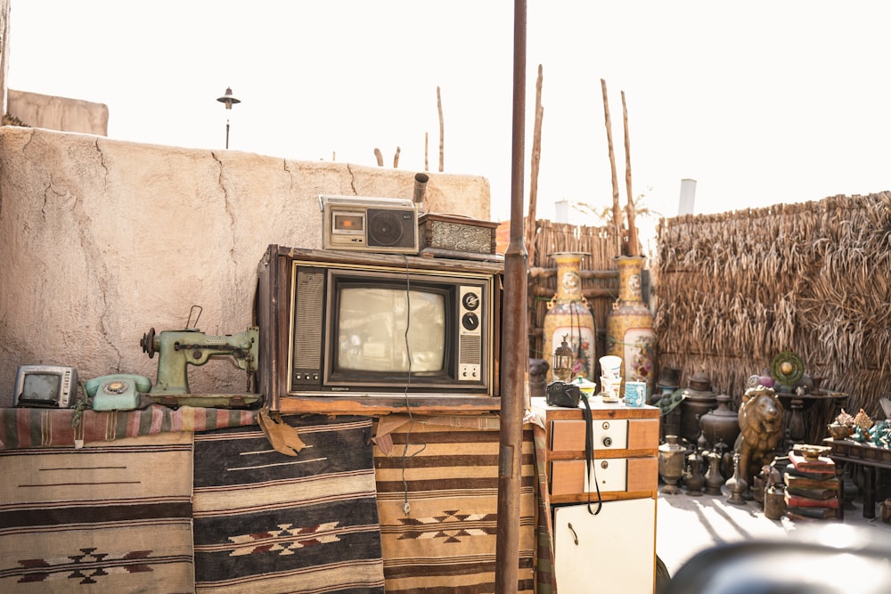 an old television sits in the middle of a village