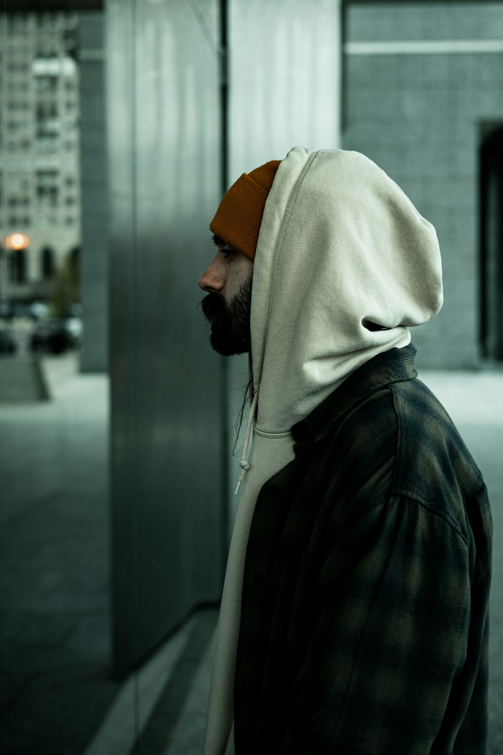 a person wearing a hoodie and a scarf
