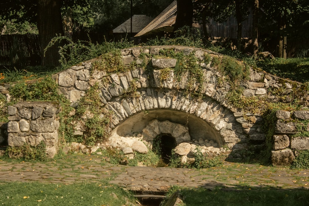 a stone tunnel in a yard