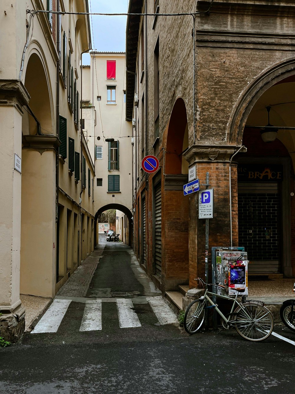 a bicycle parked on the side of a street